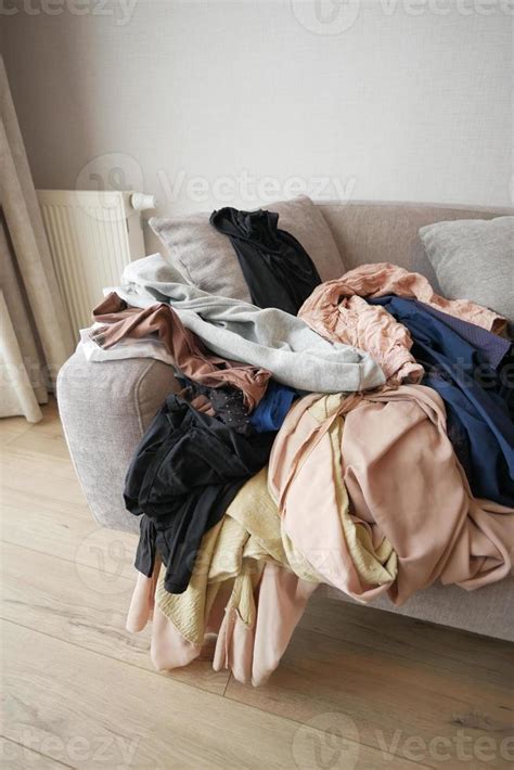 Messy Clothes On Sofa At Home 22961175 Stock Photo At Vecteezy