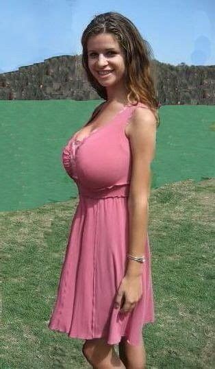 A Woman In A Pink Dress Posing For The Camera With Her Hand On Her Hip