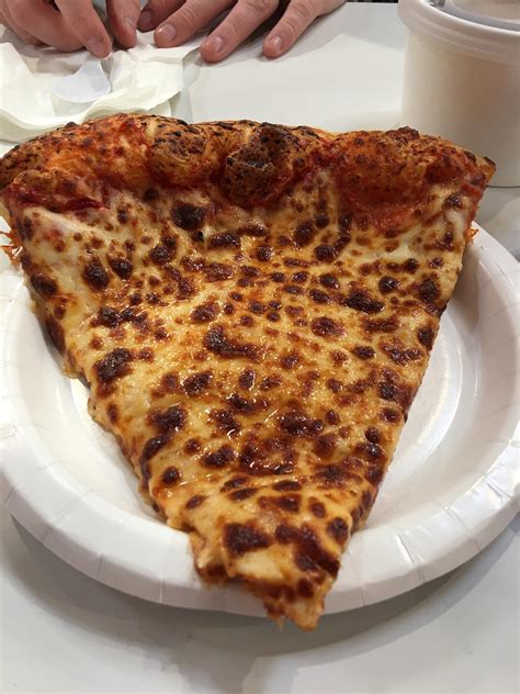 A slice costs $1.99, and a full pizza costs $9.95. OC Cheeeeese pizza from Costco. 3024X4032 : FoodPorn