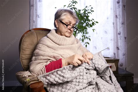 Close Up Portrait Of Senior Woman Knitting With Wool Grandmothers