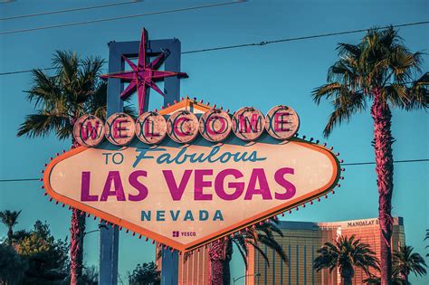 Las Vegas Welcome Sign With Vegas Strip In Background Photograph By