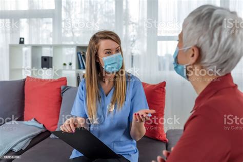 Nurse Takes Care Of Old Patient Stock Photo Download Image Now 25