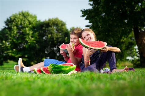 Boy And A Girl Eating Watermelon On A Sunny Day Stock Image Image Of