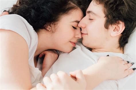 Premium Photo Couple In Love Sleeps Cuddling In Bed