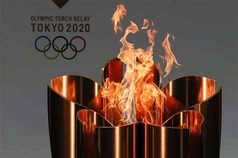 torch relay for tokyo olympics kicks off its 121 day journey
