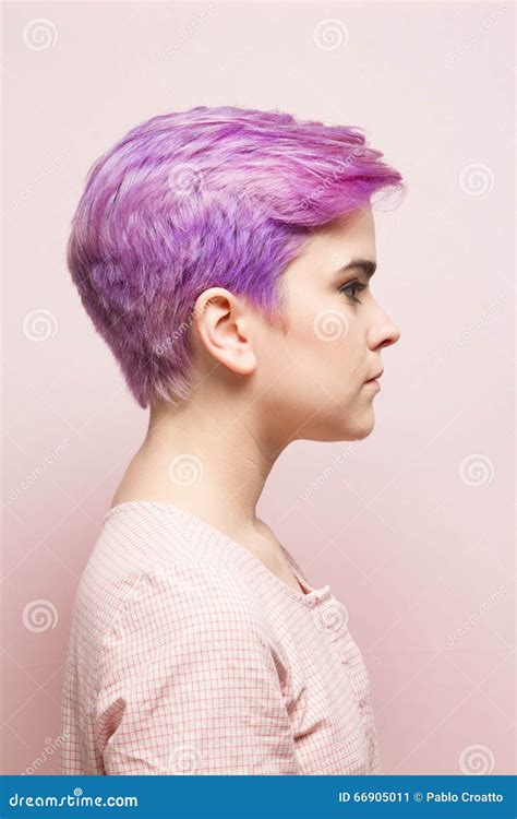 Profile Of A Violet Short Haired Woman In Pink Pastel Stock Image