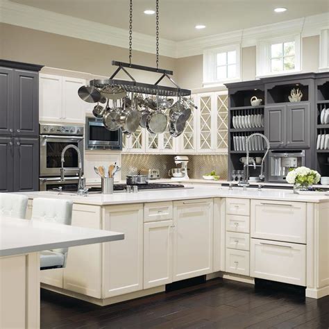 Since green is the complementary color for red, a sage green contrasting island will not look out of place in a kitchen with cherry cabinets. Contrast cabinet colors has been a growing trend for a while. Our design center offers custo… in ...