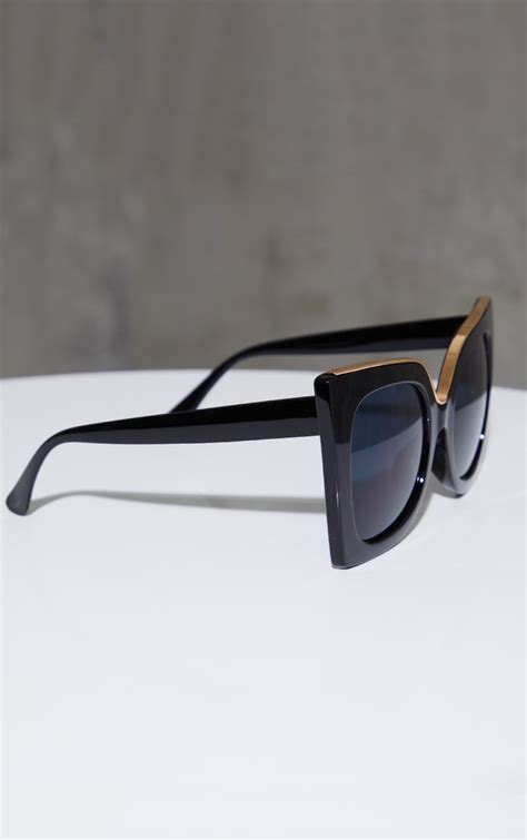 black oversized gold frame cat eye sunglasses prettylittlething