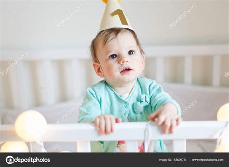 Baby Girl In Birthday Hat Stock Photo By ©iatanni 168896738