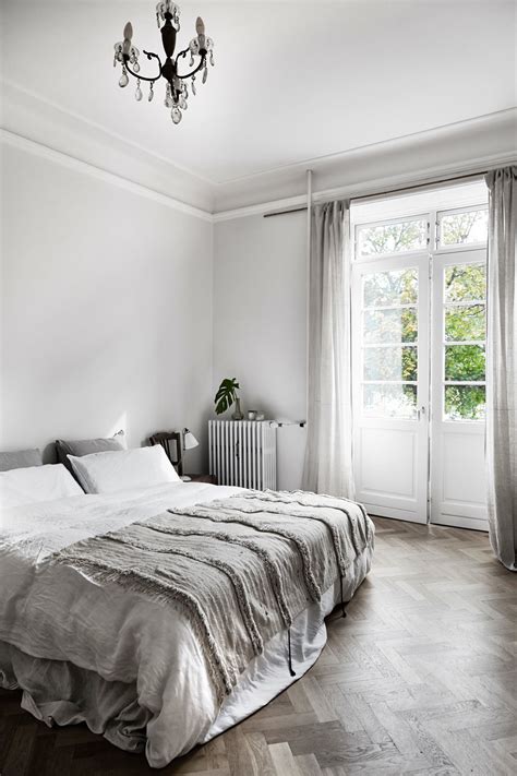 A simple framed bird soaring through the sky is. A beautiful and simple grey bedroom with grey bedding ...