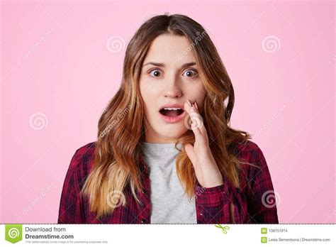 Photo Of Terrified Cute Female Model Looks With Hush Reaction At Camera