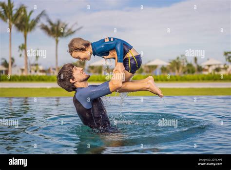 Father And Son Having Fun In The Swimming Pool Stock Photo Alamy