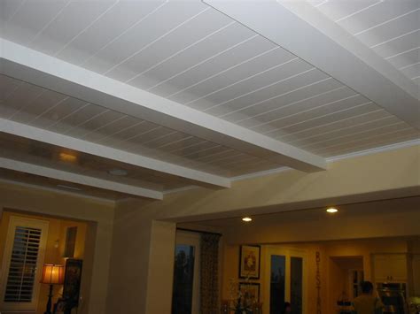 Finishing basement, want to hang drop ceiling panels, however there is ductwork running through one side, dont want to drop whole ceiling below this cause it does not have tall floor to ceiling height, does this need to be drywalled or can drop panels be hung vertically to go around duct? 7 Cheap Basement Ceiling Ideas March 2021 - Toolversed