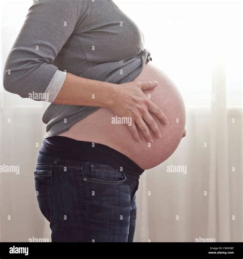 Pregnant Caucasian Woman Caressing Stomach Stock Photo Alamy