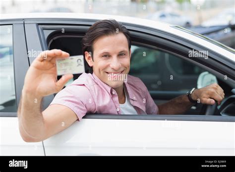 Man Smiling And Holding His Driving License Stock Photo Alamy