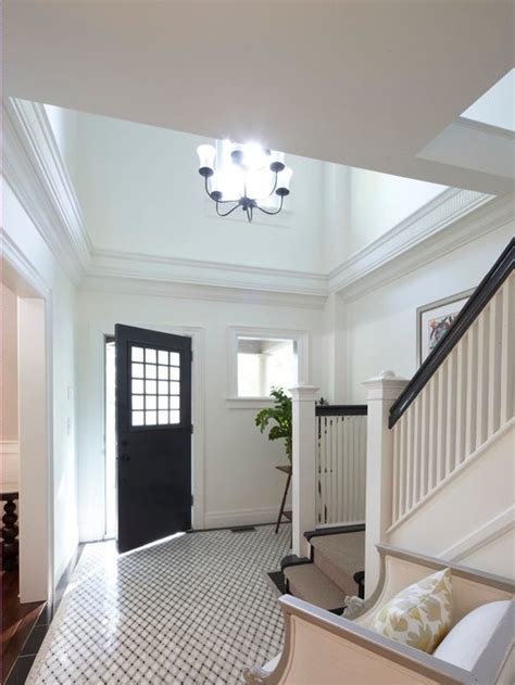 Painting the eaves of a house is challenging, particularly when they are recessed. Two Story Foyer | Houzz