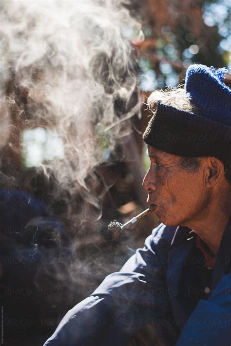 Old Man Smoking Pipe By Stocksy Contributor Chalit Saphaphak Stocksy