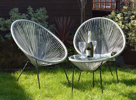 Hand braided rattan chair with natural finish. Garden Rattan Glass Round Table & 2 Papasan Egg Chairs ...