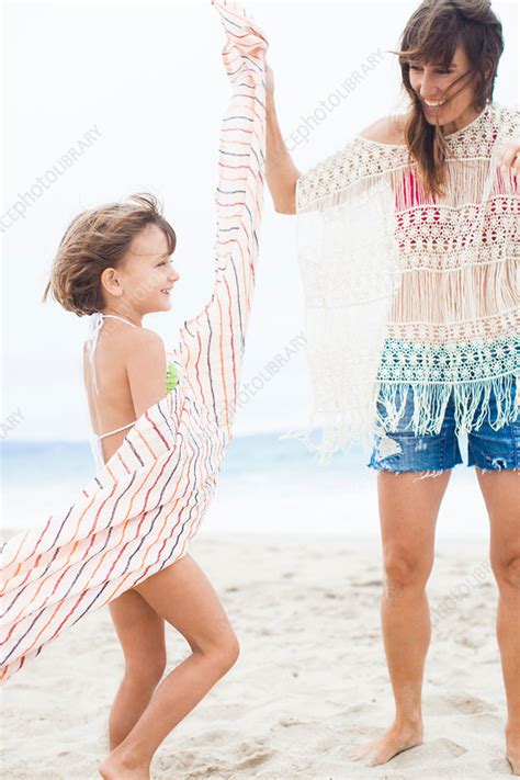 Mother Twirling Striped Towel Around Daughter Stock Image F0191537 Science Photo Library