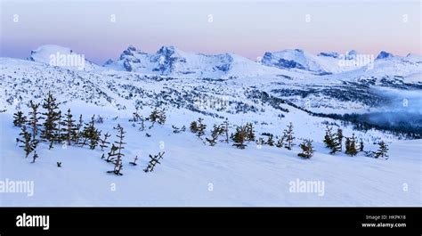 Distant Snowy Mountains Landscape And Winter Sunset Alpenglow At