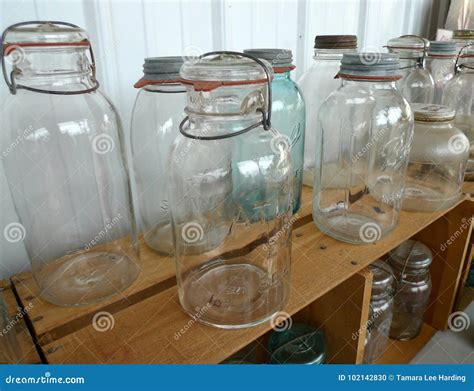Antique Glassware, Ball Canning Jars with Lightening Lids Editorial