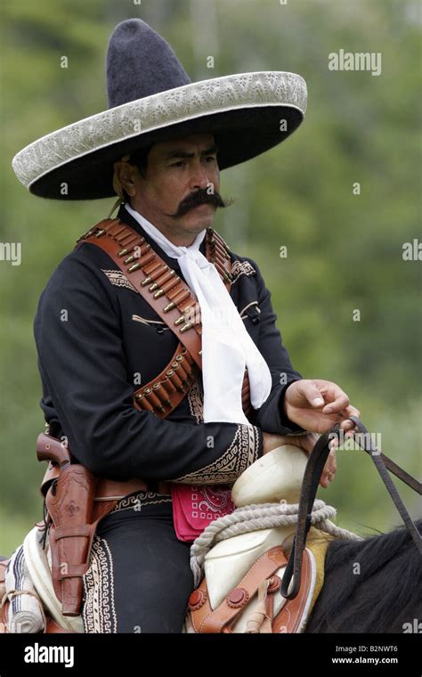 A Mexican Cowboy On Horseback Stock Photo Alamy