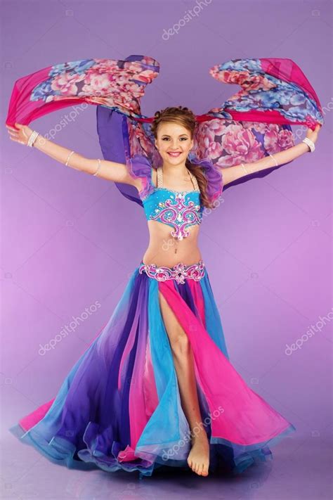 Beautiful Belly Dancer Wearing A Purple Costume Stock Photo By
