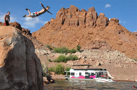 Cliff Jumping Off The Red Rocks At Lake Powell Utah Good