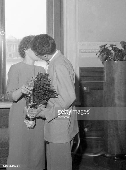 A Newly Married Russian Couple Kissing In The Registrar Office In