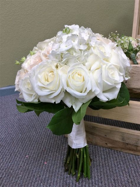 Perfect for any elegant and tasteful brides. Wedding bridal bouquet. Pure white roses ........there are ...