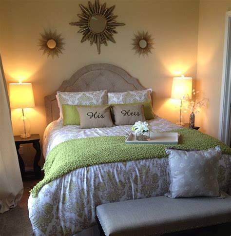 Beige And Green Accent Master Bedroom With His And Hers Pillows Room
