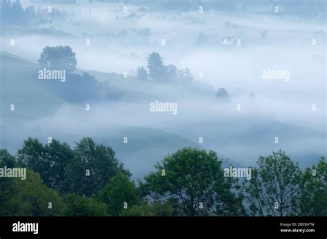 Morning Landscape With Fog In The Mountain Village Stock Photo Alamy