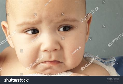 Angry Baby On A Blue Background Closeup Stock Photo 66987220 Shutterstock