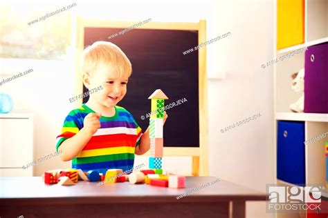 Little Child Playing With Blocks Boy Building Towers Stock Photo
