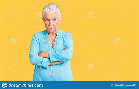 Senior Beautiful Woman With Blue Eyes And Grey Hair Wearing Summer