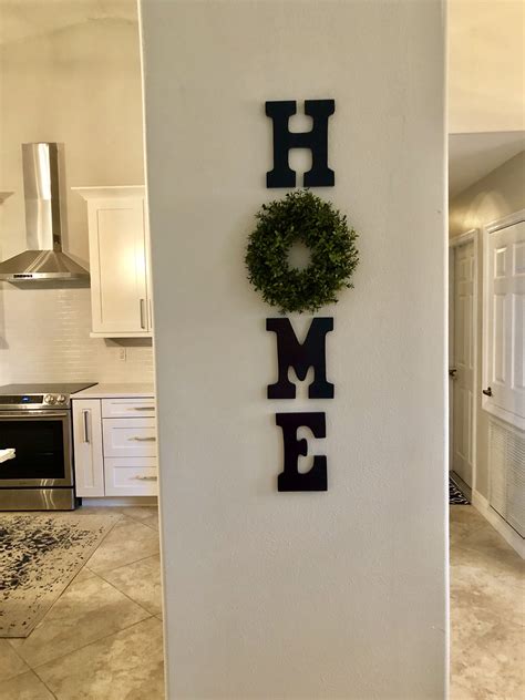 .60's home decor, bohemian wall decor, and even funky psychedelic wall decor themes. DIY "home" sign with wreath | Home sign with wreath, Art ...