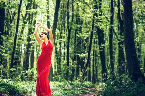 Woman In Long Red Dress Walking In The Forest — Stock Photo © Bedya