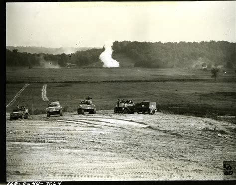 A Plume Of White Phosphorus From A Shell Juts Up On The Horizon During