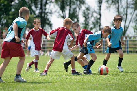 Kids Playing Football Outside Activ8 Education