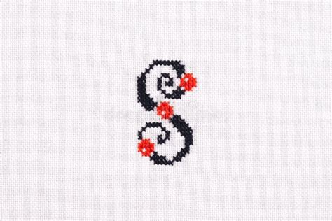 Letter S Of Embroidered Cross Stitch Latin Alphabet On White Linen