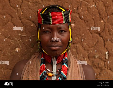 Portrait Of A Hamar Tribe Woman With Colourful Headband And Necklaces