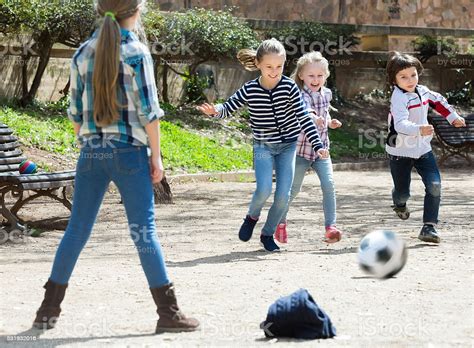 Young Kids Playing Street Football Outdoors Stock Photo Download
