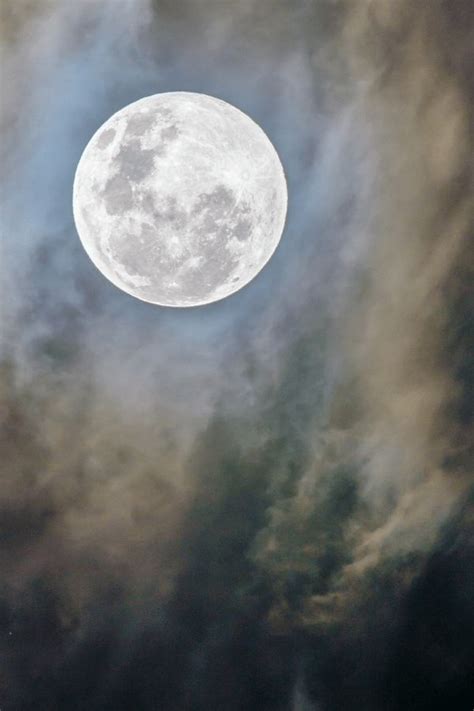 The Full Moon Is Seen Through Some Clouds