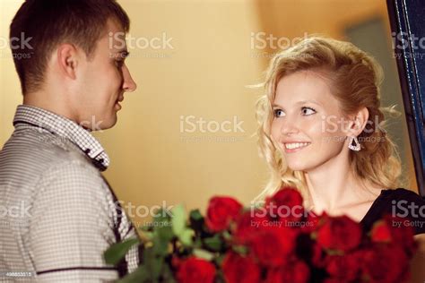 Man Gives Roses To A Girl Stock Photo Download Image Now Adult