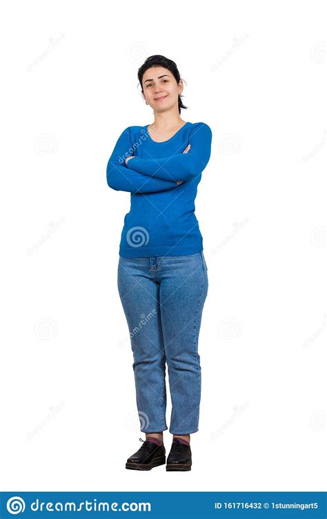 Full Length Portrait Of Casual Confident Young Woman Posing With Arms