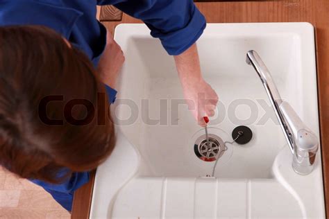 Plumber Fixing A Sink Stock Image Colourbox