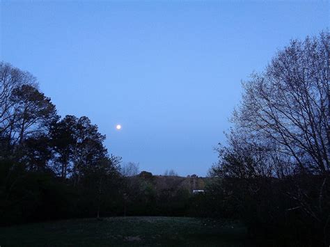 The Full Moon Sets At Sunrise