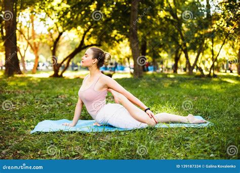 Young Girl Doing Yoga In The Park Stock Photo Image Of Lifestyle