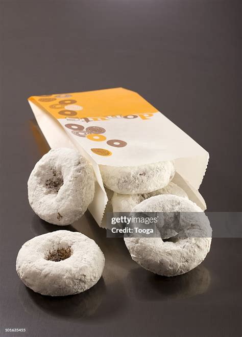 Bag Of White Powdered Donuts High Res Stock Photo Getty Images