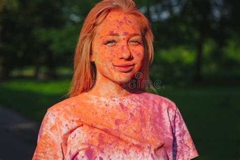 Lovely Blue Eyed Woman Covered Pink And Orange Dry Paint At The Stock